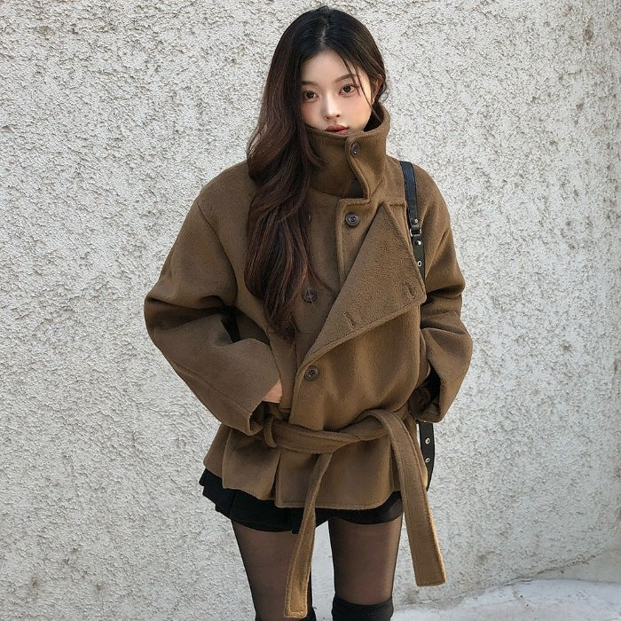 Brown wool short coat with stand-up collar, buttoned front, and tied waist belt
