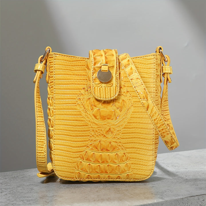 Yellow textured handbag on a gray surface with a gray background
