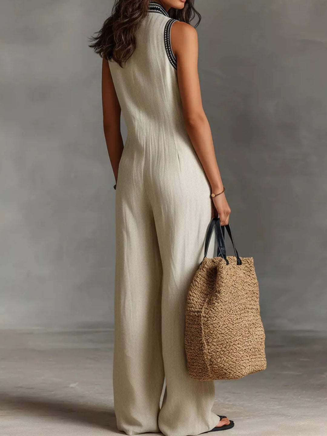 Ivory sleeveless wide-leg jumpsuit, deep V-neck with embroidered trim