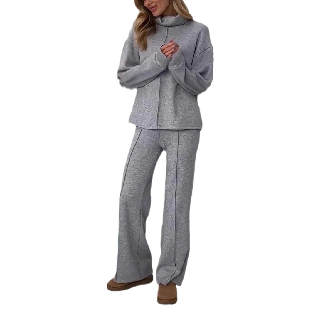 Gray tracksuit worn by a person on a white background