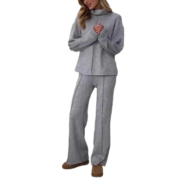Gray tracksuit worn by a person on a white background