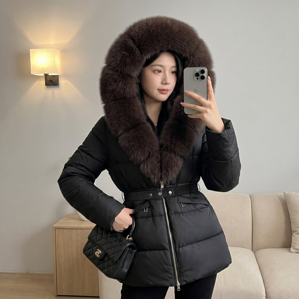 Women’s Black Hooded Puffer Coat With Belted Waist And Dark Fur Collar, Modeled Front View.