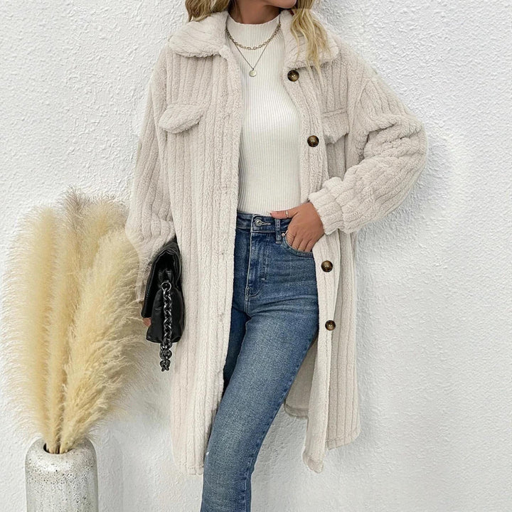 Wider Front View Of Women’s Plus Size White Mid-Length Coat Showing Vertical Texture And Button Details