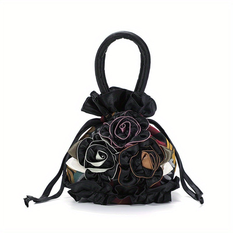 Black handbag with floral patterns on a white background