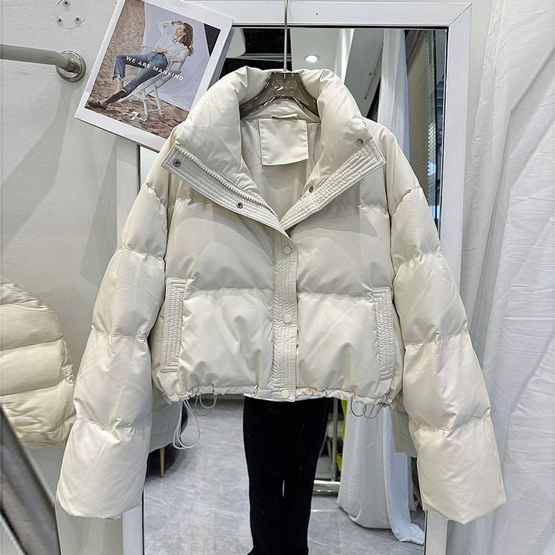 White women's puffer down coat with high neck, front zip and snap buttons