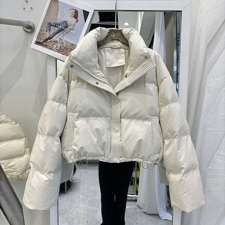 White women's puffer down coat with high neck, front zip and snap buttons