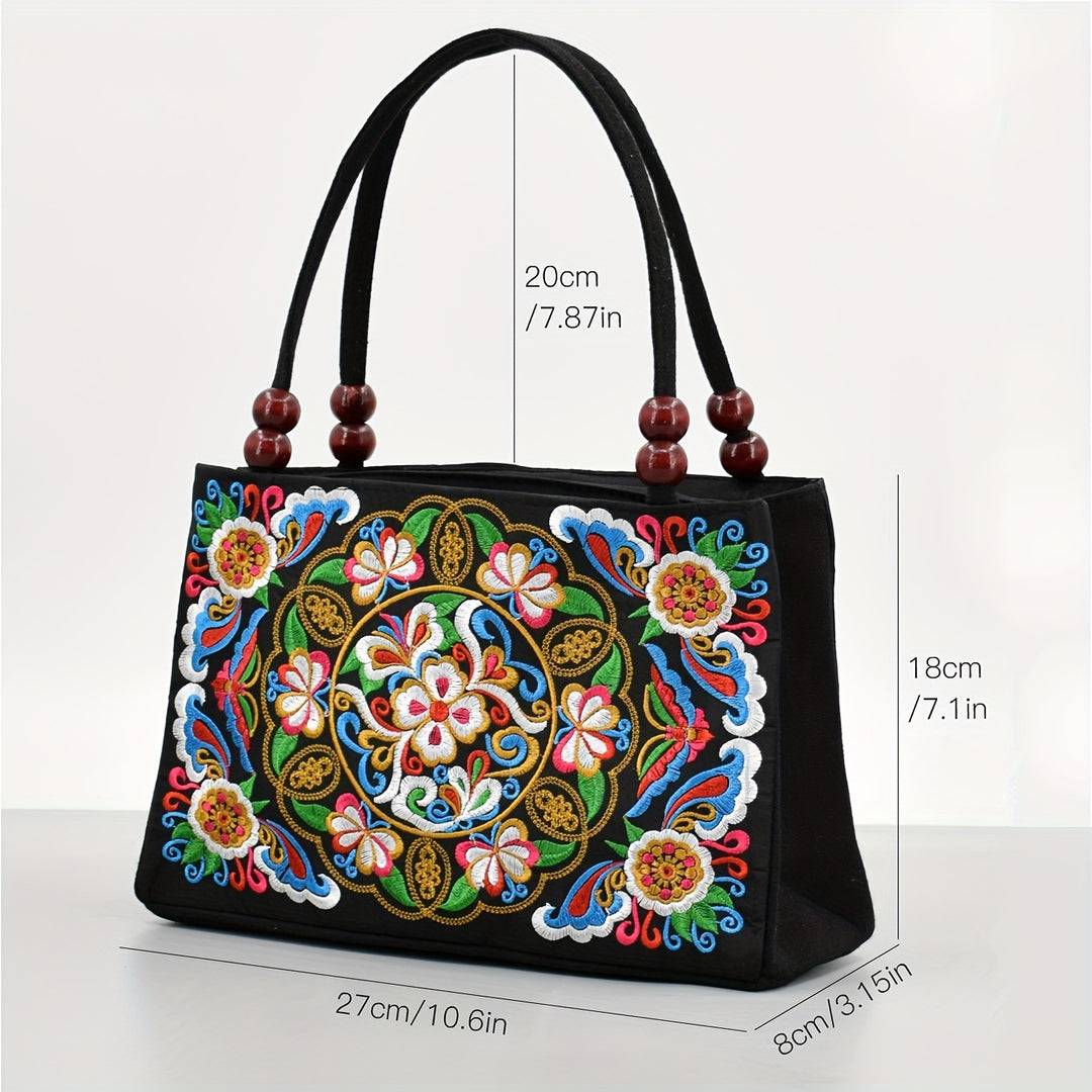 Black handbag with colorful floral embroidery and wooden beads on handles, shown with measurements.