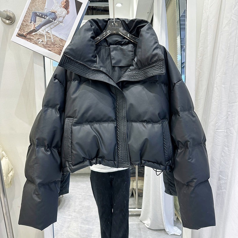 Black women's puffer down coat with high neck, front zip and snap buttons