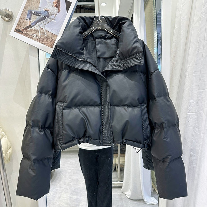 Black women's puffer down coat with high neck, front zip and snap buttons
