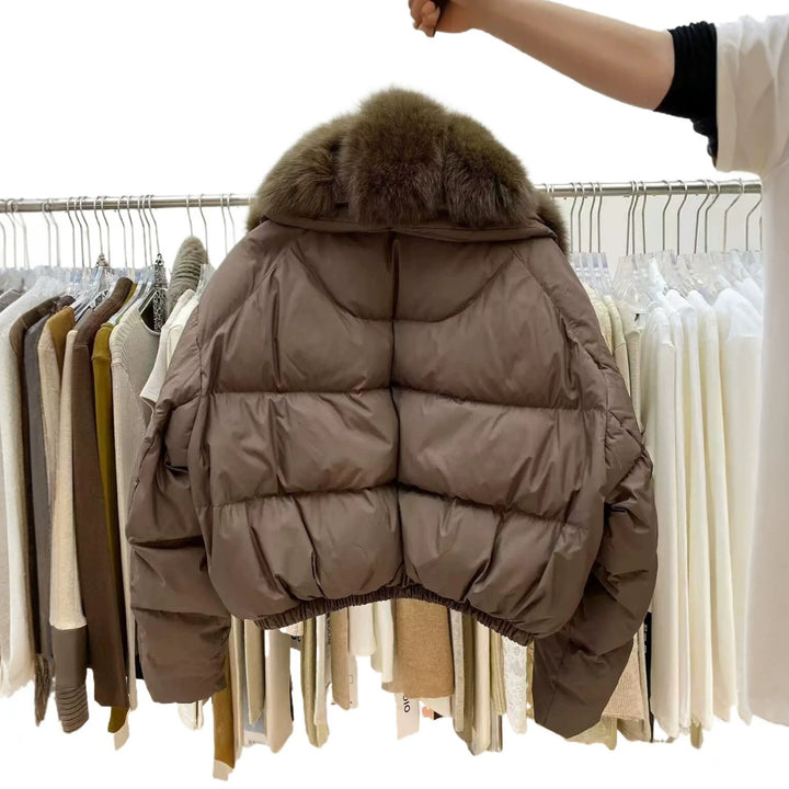 Back View Of Brown Women's Cropped Puffer Coat With Fur Collar And Quilted Panels