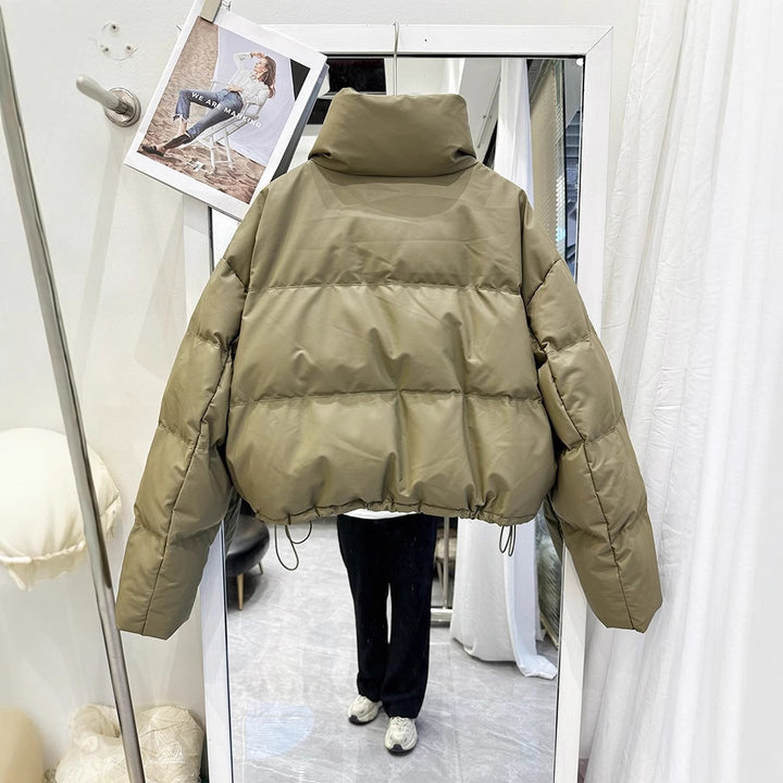 Olive green women's puffer down coat, high collar, front zip with snap buttons