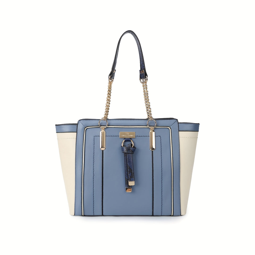 Blue and beige handbag with a chain detail on a white background