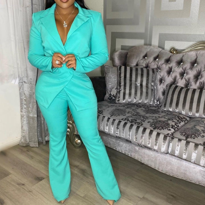 Woman wearing green  office pants suit