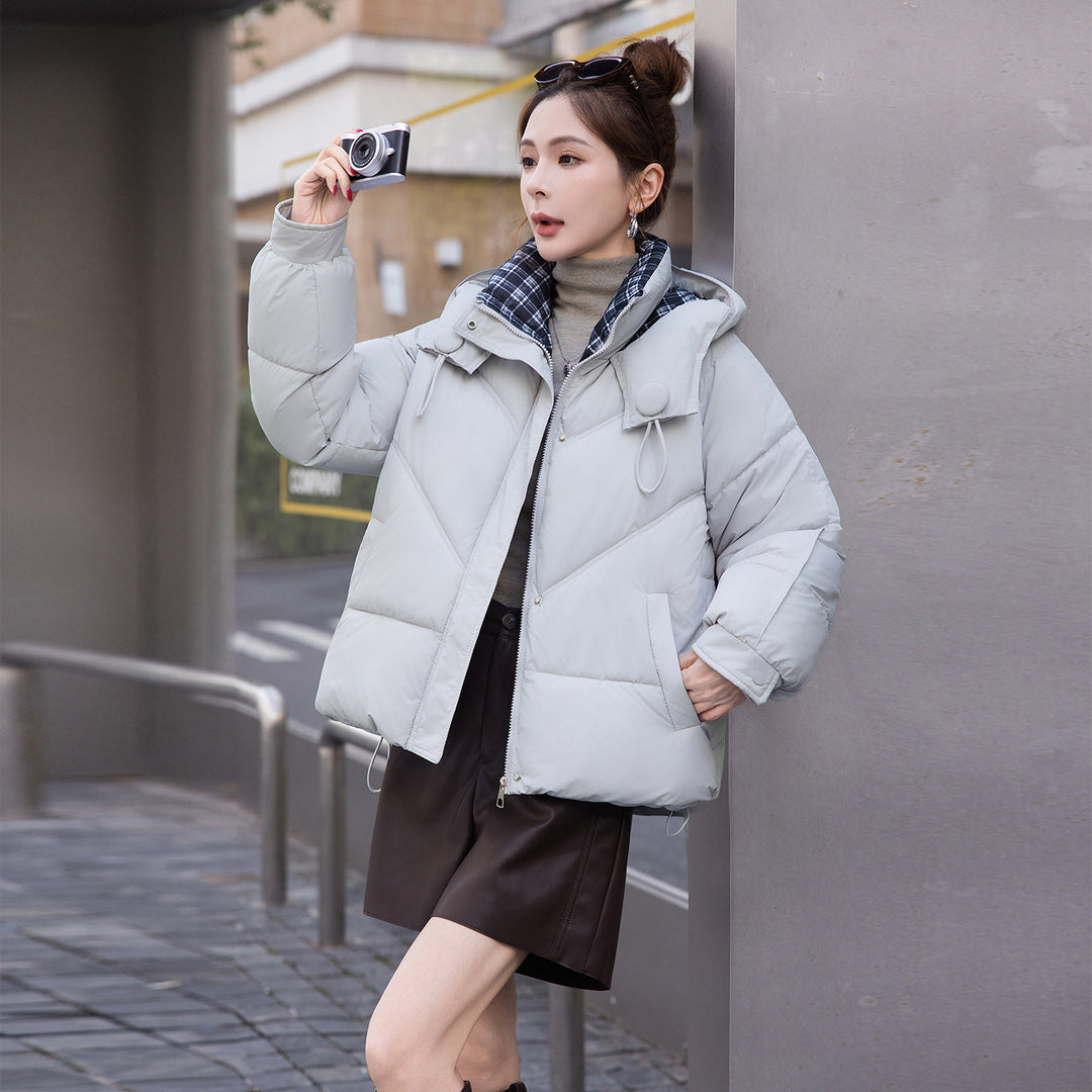Women's Light Gray Quilted Puffer Coat With Hood Worn Outdoors