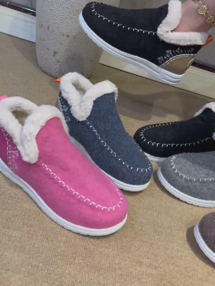 video of slip-on ankle loafer with white fleece collar and white rubber sole