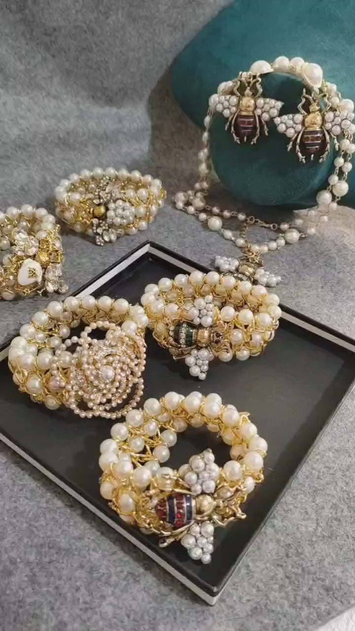 bee pendant necklace, rings, bracelet, and earrings
